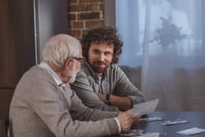 man talking to his elderly parent