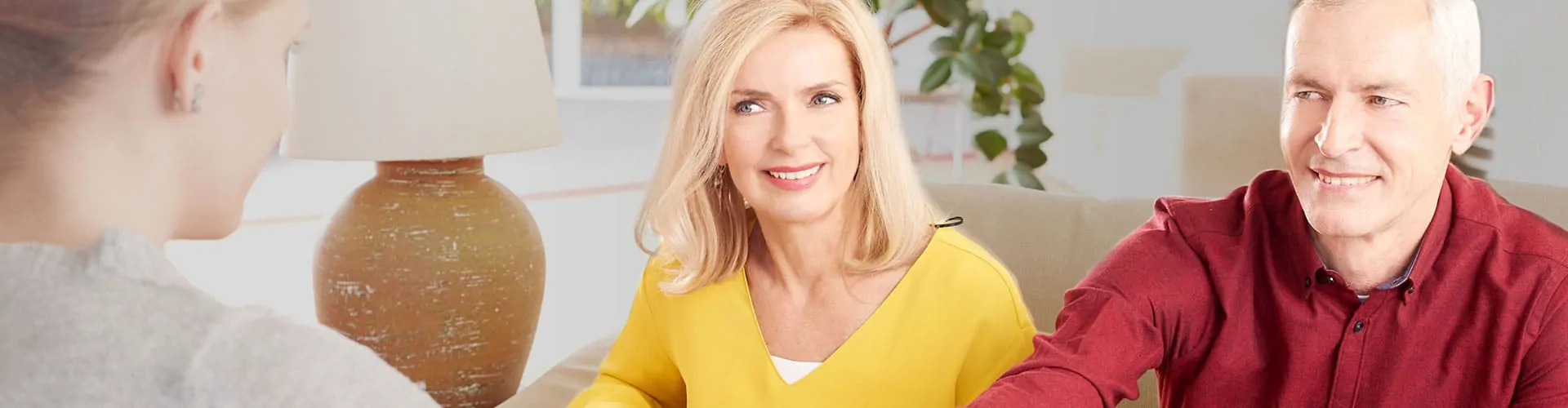 Husband and wife talking to woman